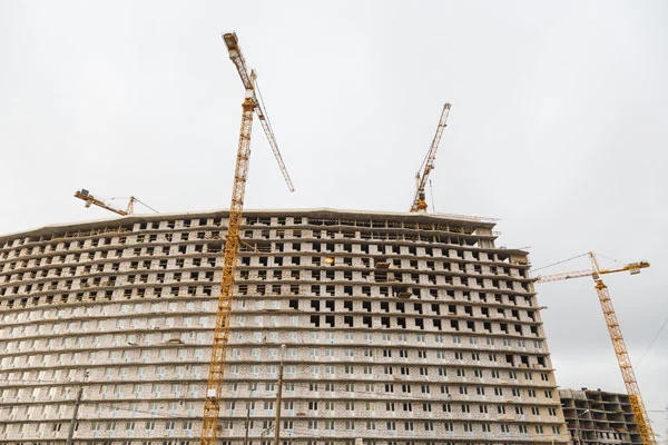 4 tower cranes used in a construction